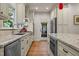 Chef's kitchen with granite countertops, custom cabinets, and stainless steel appliances at 1004 Staffield Lane Ln, Chapel Hill, NC 27516