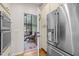 Kitchen with stainless refrigerator and access to a screened in back porch at 1004 Staffield Lane Ln, Chapel Hill, NC 27516