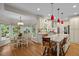 Bright kitchen boasts granite counters, custom cabinets, and adjacent breakfast nook with natural light at 1004 Staffield Lane Ln, Chapel Hill, NC 27516