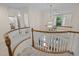 Open landing with staircase, chandelier, and natural light at 1004 Staffield Lane Ln, Chapel Hill, NC 27516
