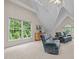 Bright living room featuring comfortable couches, hardwood accents, and a scenic view at 1004 Staffield Lane Ln, Chapel Hill, NC 27516
