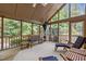 Relaxing screened-in porch with comfortable seating and natural light at 1004 Staffield Lane Ln, Chapel Hill, NC 27516