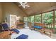 Spacious screened-in porch with views, a ceiling fan, and comfortable seating at 1004 Staffield Lane Ln, Chapel Hill, NC 27516