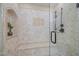 Nicely tiled walk-in shower with a built in bench and decorative tile inset at 1004 Staffield Lane Ln, Chapel Hill, NC 27516