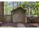 Backyard shed for extra storage surrounded by mature trees at 1004 Staffield Lane Ln, Chapel Hill, NC 27516