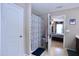 Clean bathroom with a shower/tub combination, storage, and a view into the bedroom at 101 Claystone Dr, Gibsonville, NC 27249
