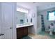 Bright bathroom featuring a sink, mirror, shower and toilet at 101 Claystone Dr, Gibsonville, NC 27249