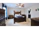 Spacious bedroom with neutral carpet, a ceiling fan, and an ensuite bathroom at 101 Claystone Dr, Gibsonville, NC 27249
