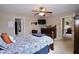 Spacious bedroom featuring a ceiling fan, large window, and ensuite bathroom at 101 Claystone Dr, Gibsonville, NC 27249