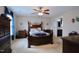 Comfortable bedroom featuring a ceiling fan, large window, and access to an ensuite bathroom at 101 Claystone Dr, Gibsonville, NC 27249