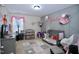 Charming Bedroom decorated with flowers and a crib with plenty of toys at 101 Claystone Dr, Gibsonville, NC 27249