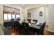 Elegant dining room set with seating for six, with a view into the living area at 101 Claystone Dr, Gibsonville, NC 27249