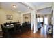 Cozy dining area with a sleek table set, hardwood flooring, and warm lighting at 101 Claystone Dr, Gibsonville, NC 27249
