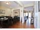 Elegant dining room with hardwood floors, modern lighting, and an open view to the inviting living area at 101 Claystone Dr, Gibsonville, NC 27249