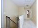 Upstairs hallway with a baby gate at the top of the stairs at 101 Claystone Dr, Gibsonville, NC 27249