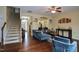 Inviting living room with hardwood floors, staircase, and comfortable seating at 101 Claystone Dr, Gibsonville, NC 27249