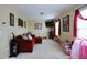 Spacious living room with a cozy couch and a variety of toys and decor at 101 Claystone Dr, Gibsonville, NC 27249
