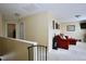 Upstairs landing with a comfortable seating area and carpet flooring at 101 Claystone Dr, Gibsonville, NC 27249