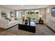 Bright living room with large windows, offering views of the outdoors and comfortable seating at 1033 Masters Place Way # 110, Durham, NC 27703