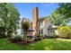 Backyard with patio area and mature landscaping providing privacy at 105 Spring Bud Dr, Cary, NC 27513