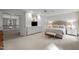 Large bedroom featuring a built-in entertainment center and neutral colors at 105 Spring Bud Dr, Cary, NC 27513