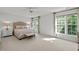 Bright and airy bedroom with large windows and neutral decor at 105 Spring Bud Dr, Cary, NC 27513