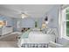 Spacious bedroom with natural light, two beds, and stylish decor at 105 Spring Bud Dr, Cary, NC 27513