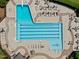 Aerial view of the community pool with diving board, lap lanes, lounge chairs, tables, and umbrellas at 105 Spring Bud Dr, Cary, NC 27513