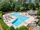Aerial shot of a community pool featuring plenty of lounge seating and manicured landscaping at 105 Spring Bud Dr, Cary, NC 27513