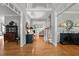 Inviting foyer featuring hardwood floors, elegant decor, and a view of the living spaces at 105 Spring Bud Dr, Cary, NC 27513