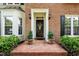 Charming front entrance featuring a brick pathway, decorative plants, and a welcoming door at 105 Spring Bud Dr, Cary, NC 27513
