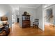 Hallway view featuring hardwood floors, detailed trim, and views to other rooms at 105 Spring Bud Dr, Cary, NC 27513