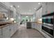 Bright kitchen with stainless steel appliances, stone countertops and gas cooktop at 105 Spring Bud Dr, Cary, NC 27513