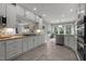 Eat-in kitchen with stainless appliances and view to sitting room at 105 Spring Bud Dr, Cary, NC 27513
