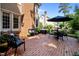 Brick patio with outdoor seating, grill, and lush landscaping perfect for entertaining and enjoying outdoor dining at 105 Spring Bud Dr, Cary, NC 27513