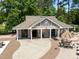 Aerial view of a community pool house with restrooms, showers, and outdoor seating area at 105 Spring Bud Dr, Cary, NC 27513