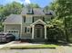 Charming two-story home with a traditional design, dormer windows, and a covered front porch at 110 Ruth St, Carrboro, NC 27510