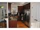 Modern kitchen featuring granite countertops, stainless steel appliances, and wooden floors at 110 Ruth St, Carrboro, NC 27510