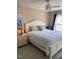 A bedroom that offers natural lighting with a ceiling fan, and bedside lamp at 11017 Peacock Moss St, Raleigh, NC 27613