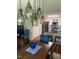 Modern dining room with stylish pendant lights and eat in bar with black stainless steel appliances at 11017 Peacock Moss St, Raleigh, NC 27613