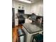 This is a kitchen with stainless steel appliances, granite countertops, and white cabinets at 11017 Peacock Moss St, Raleigh, NC 27613