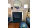 Cozy living room with fireplace and decor, featuring hardwood floors and natural light at 11017 Peacock Moss St, Raleigh, NC 27613