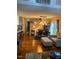 This is a dining area, living room, and staircase to a loft area with hardwood floors at 11017 Peacock Moss St, Raleigh, NC 27613