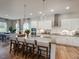 Bright modern kitchen with an island, stainless steel appliances, and pendant lighting at 1107 Masters Place Way # 155, Durham, NC 27703