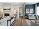 Cozy living room with a fireplace, comfortable seating, and wood flooring at 1107 Masters Place Way # 155, Durham, NC 27703