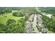 Street-level view of several homes in a community surrounded by lush greenery and trees at 112 Filigree Way, Durham, NC 27713
