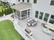 Spacious deck with dining and lounging area attached to a screened porch at 112 Filigree Way, Durham, NC 27713