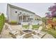 Expansive backyard with fire pit, swing set, and outdoor living area provides a perfect retreat at 112 Filigree Way, Durham, NC 27713