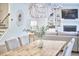 Cozy dining area with rustic wood table, upholstered chairs, and decorative chandelier at 112 Filigree Way, Durham, NC 27713