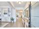 Inviting foyer featuring hardwood floors, decorative mirrors, and built-in shelving for a stylish entryway at 112 Filigree Way, Durham, NC 27713